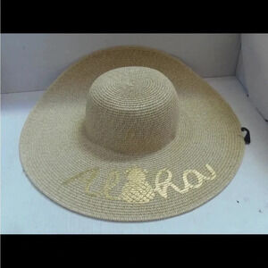 - WIDE BRIM STRAW HAT WITH METALLIC GOLD ALOHA WRITTEN IN SCRIPT
